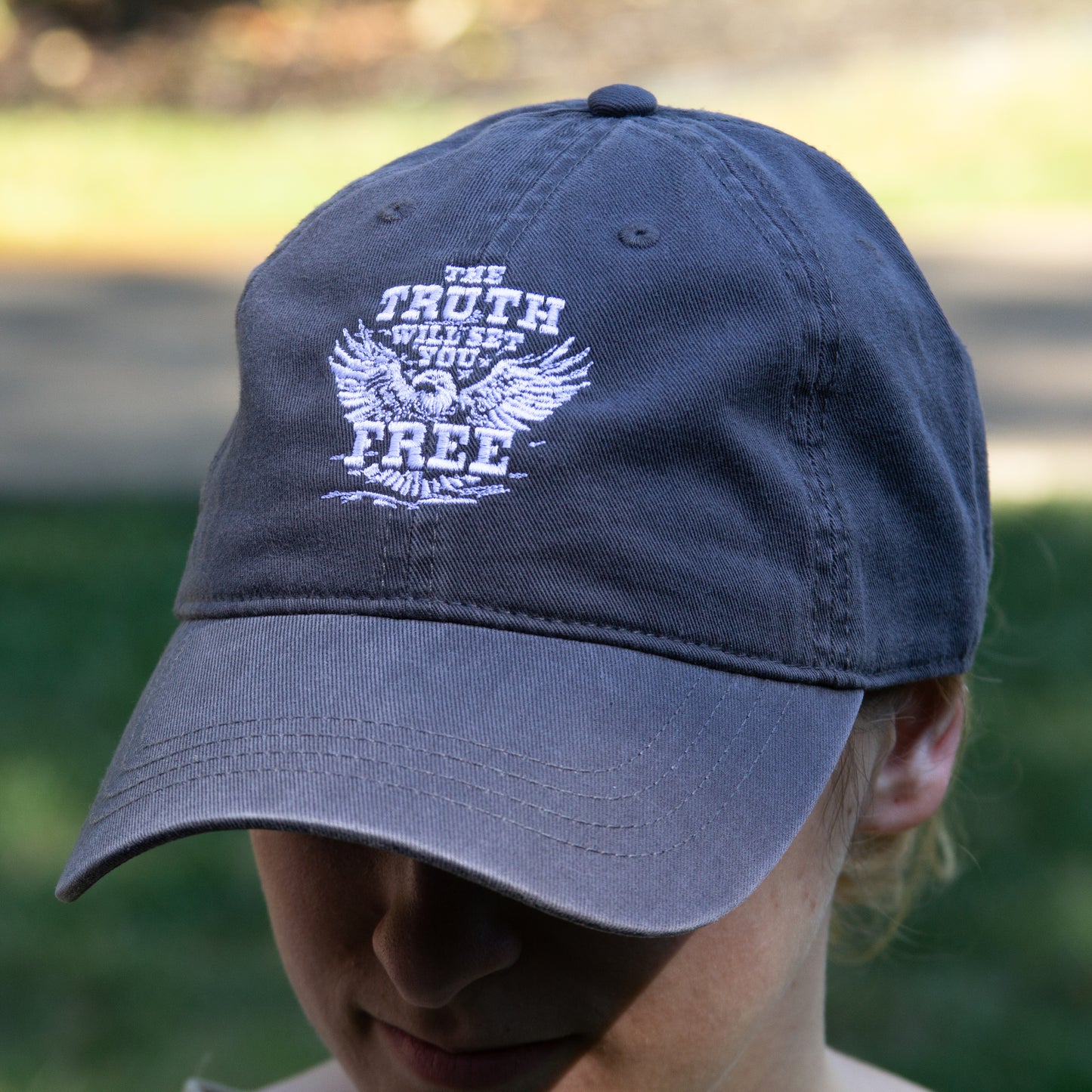 The Truth Eagle hat - charcoal color with white embroidered Truth logo on the front.