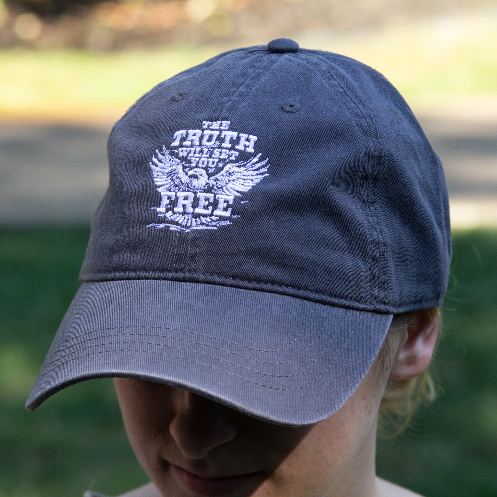 The Truth Eagle hat - charcoal color with white embroidered Truth logo on the front.